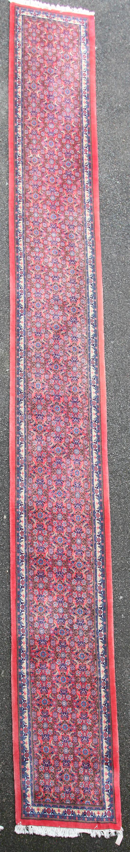 A Persian runner, 21ft 10in. x 2ft 9in.
